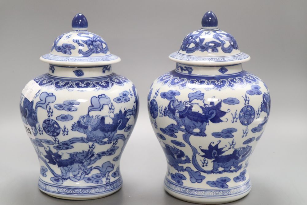 A pair of Chinese blue and white dragon vases, height 26cm